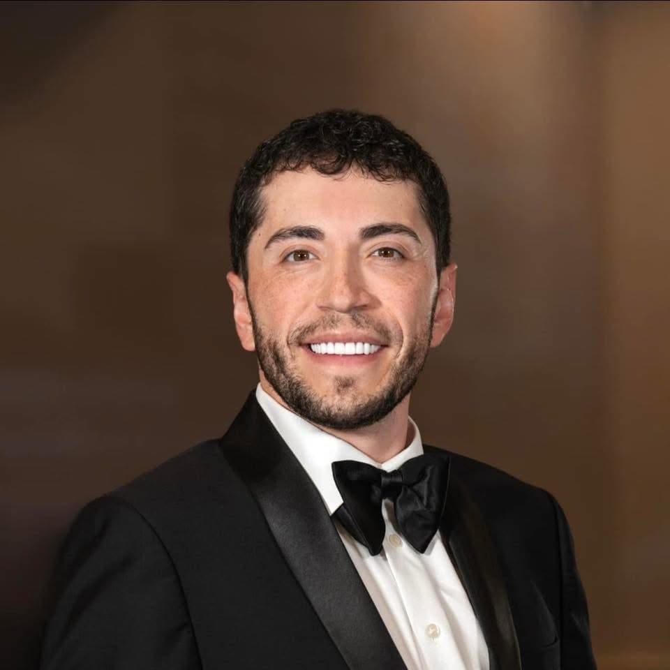 Josh Snow, founder of Community Seeding — operator portrait in formal attire